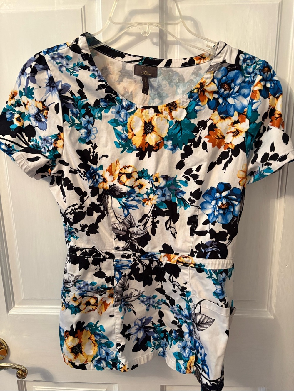 Jaanuu floral peplum scrub top